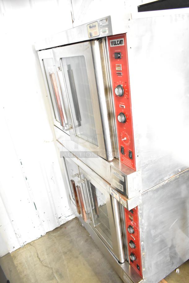 2 Vulcan SG4D commercial gas ovens with view through doors, thermostatic controls, minor wear, visible labels.