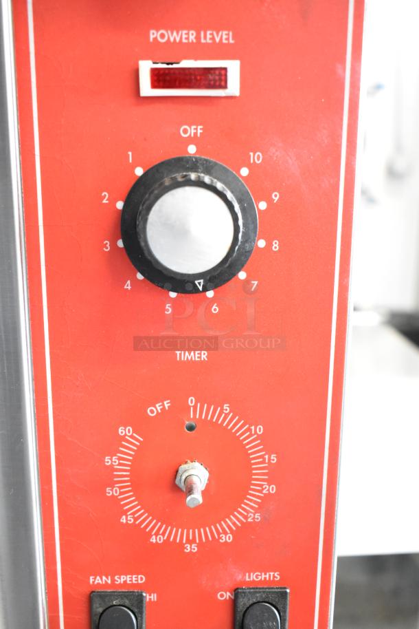 Vulcan SG4D convection oven controls, featuring power level and timer dials, fan speed and light switches.