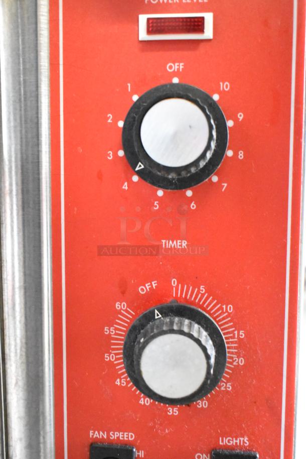 Vulcan SG4D convection oven control panel with dials for power level and timer, featuring fan speed settings.
