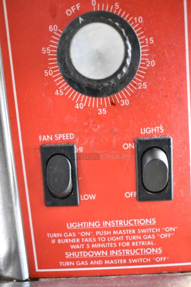 2 Vulcan SG4D commercial gas convection ovens, full size, view-through doors, thermostatic controls. Control panel with fan speed and lighting switches; lighting and shutdown instructions visible.