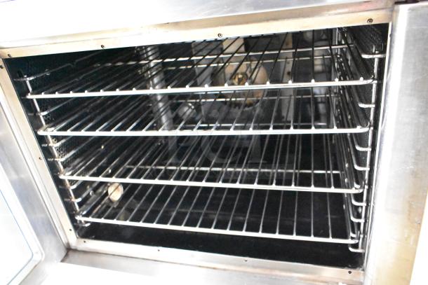 2 Vulcan SG4D commercial convection ovens, gas-powered, full size, view-through doors, thermostatic controls, interior racks visible.