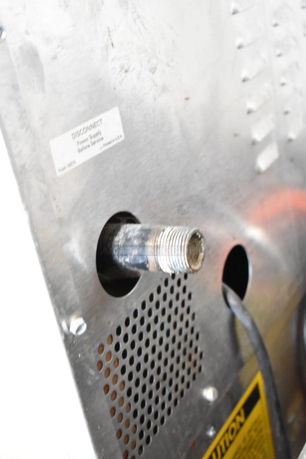 Rear view of Vulcan SG4D commercial convection oven, showing power connection point and caution label.