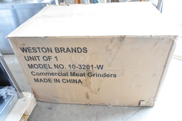 Brand new Weston 10-3201-W #32 Pro Series Electric Meat Grinder box showing scratches and dents, 120 volts, 1 phase.