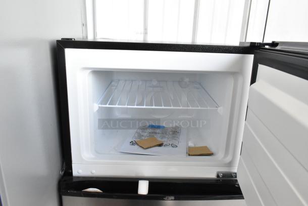 Brand new Vissani MDFF7SS reach-in cooler with freezer, 115 volts, 1 phase, scratch and dent condition, interior view.
