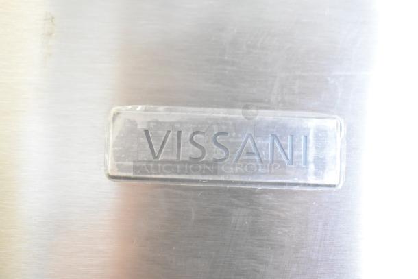 Vissani logo on stainless steel surface of MDBF18SS cooler with freezer drawer, showing light wear.