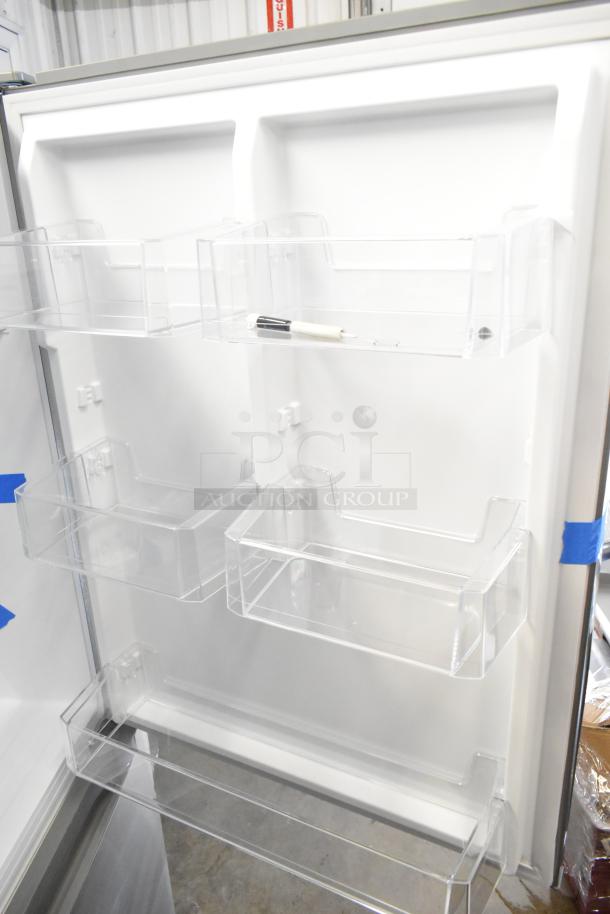 Brand new Vissani MDBF18SS reach-in cooler interior, showing clear door shelves. Scratch and dent condition. 115 volts, 1 phase.