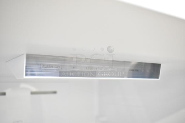 Brand new Vissani MDBF18SS reach-in cooler with freezer drawer. Features control panel with fridge and freezer settings. 115 volts, 1 phase.