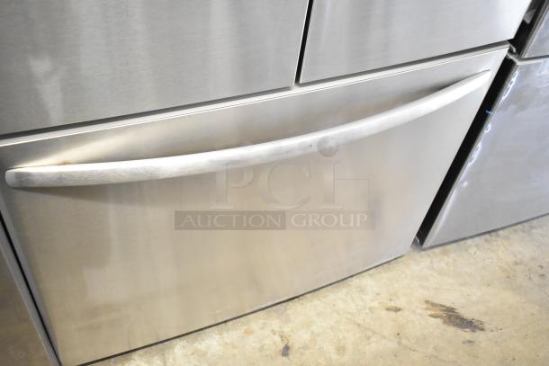 Brand new Frigidaire FRFC2323ASB reach-in cooler with freezer drawer, scratch and dent condition, stainless steel finish.