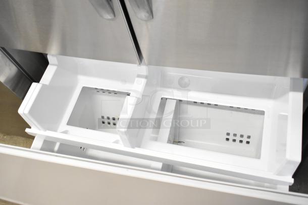 BRAND NEW Frigidaire FRFC2323ASB Reach-In Cooler with freezer drawer, ice/water dispenser. Visible interior compartments.