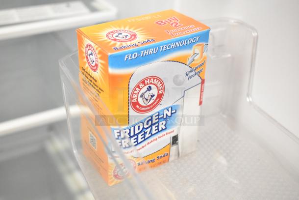 Box of Arm & Hammer Fridge-N-Freezer Baking Soda. Features Flo-Thru Technology, in clear fridge compartment.