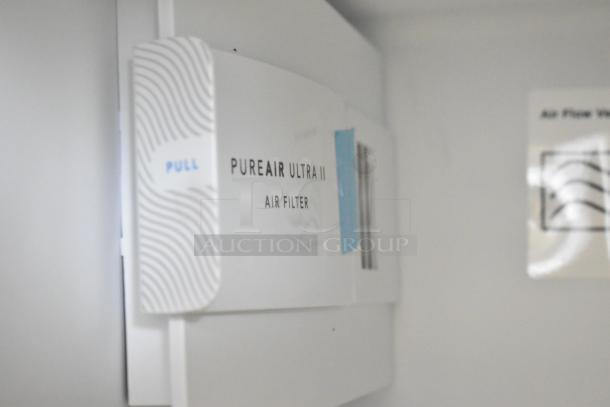 Frigidaire FRSS2623ASN air filter compartment, labeled "PureAir Ultra II," shown inside the cooler.