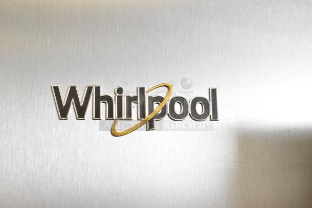 "Whirlpool branding on stainless steel surface of 2025 WRSC6536RZ00 reach-in cooler with freezer and ice/water dispenser."
