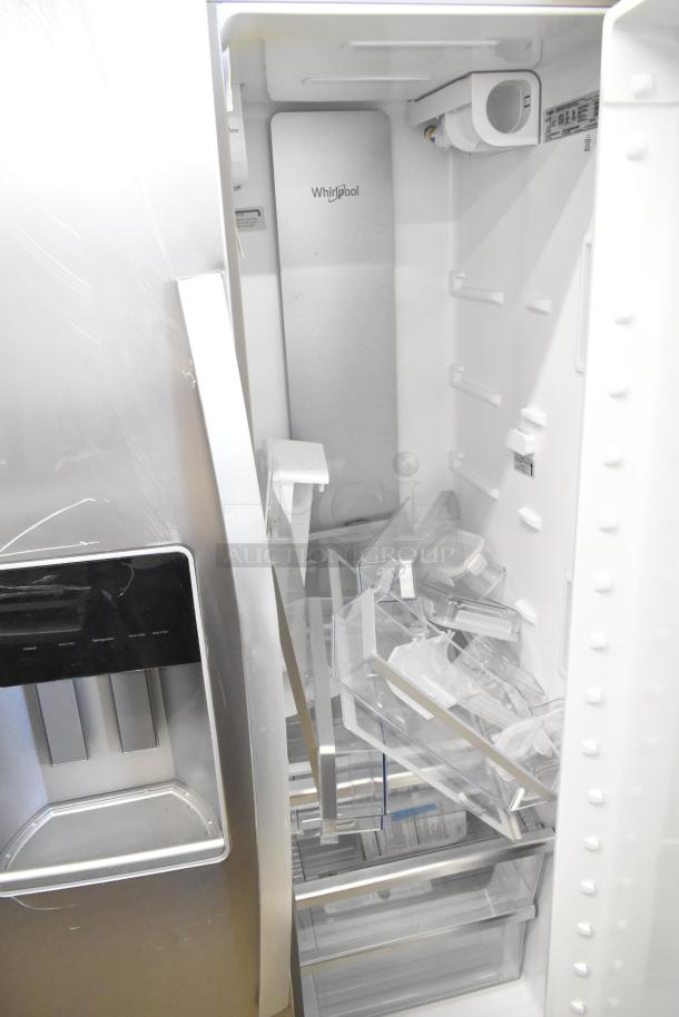 "Brand new Whirlpool WRSC6536RZ00 reach-in cooler with freezer. Features ice/water dispenser. Minor scratches visible."