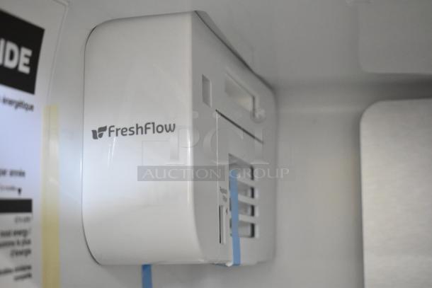 Whirlpool WRSC6536RZ00 cooler interior showing FreshFlow filter system, brand new condition.