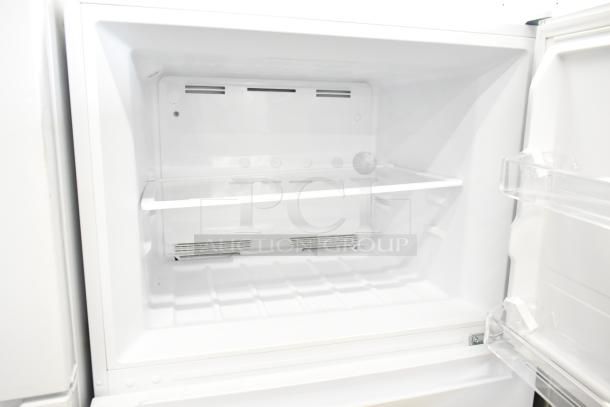 Brand new Vissani MDTF18WHR5 reach-in cooler with freezer, 115V, 1 phase, scratch and dent, white interior, single shelf.
