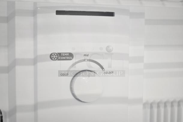 "Brand new Vissani MDTF18WHR reach-in cooler with freezer, 115V, 1 phase, features temperature control dial."