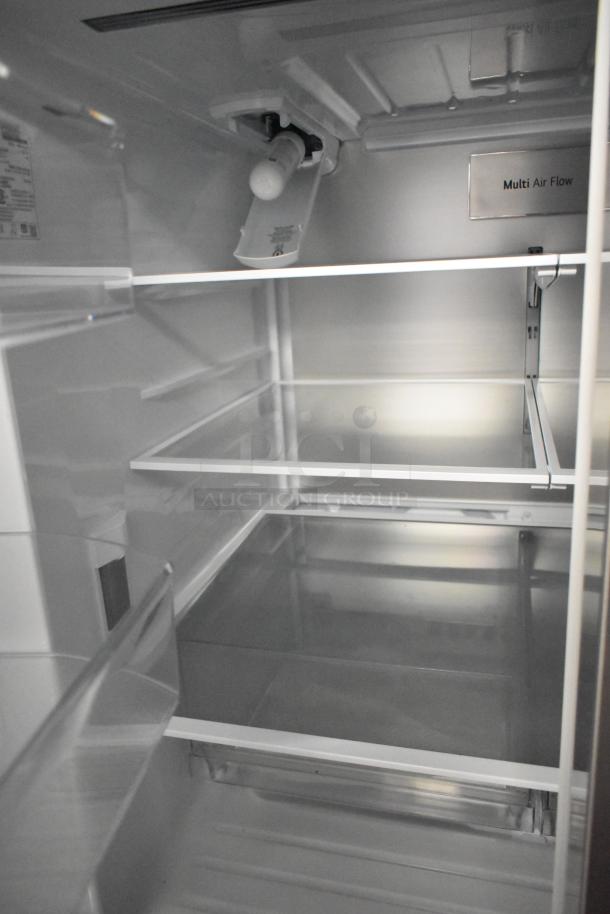 LG LF30S8210S/01 cooler interior, showcasing adjustable glass shelves, Multi Air Flow label visible, pristine condition.