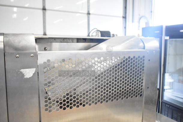 JBT 2ND-GEN-MFJ-HE commercial citrus juicer, floor style, stainless steel, mounted on casters, visible side panel vents.