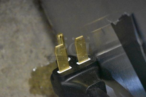 Power cord of Vollrath 922CM424035 JW30 Cheese Melter, showing standard plug; brand new with minor scratches.