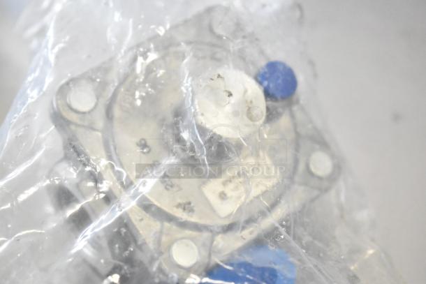 Plastic-wrapped component of a brand new, scratch and dent Cooking Performance Group R-CPG-24-NL 4 Burner Gas Range.