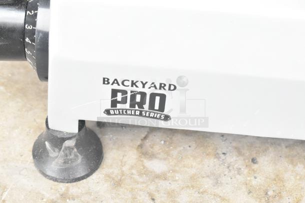 2021 Backyard Pro 554SL112E Butcher Series 12" meat slicer with sharpener, visible branding, manual gravity feed, 120V.