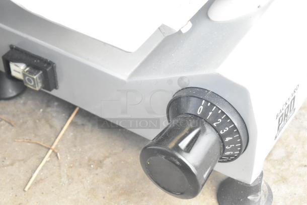 2021 Backyard Pro 554SL112E meat slicer with 12" blade, manual gravity feed, blade sharpener, dial settings; 120V, 1 phase.