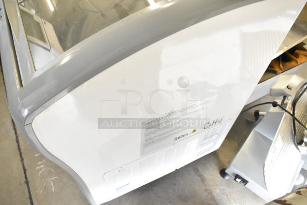 Avanti CFC436Q0WG chest freezer on commercial casters, 115 volts, 1 phase, white, visible safety and specification labels.