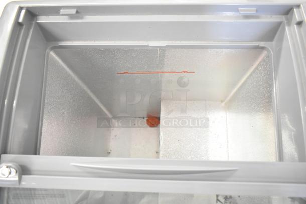 Avanti CFC436Q0WG chest freezer interior; spacious, with maximum capacity edge label visible. Commercial casters included. 115 volts, 1 phase.
