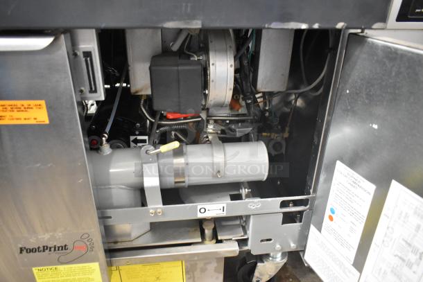 Brand new Frymaster FPPH255CSE commercial propane fryer with 4 metal baskets, filtration system, on casters, 80,000 BTU.