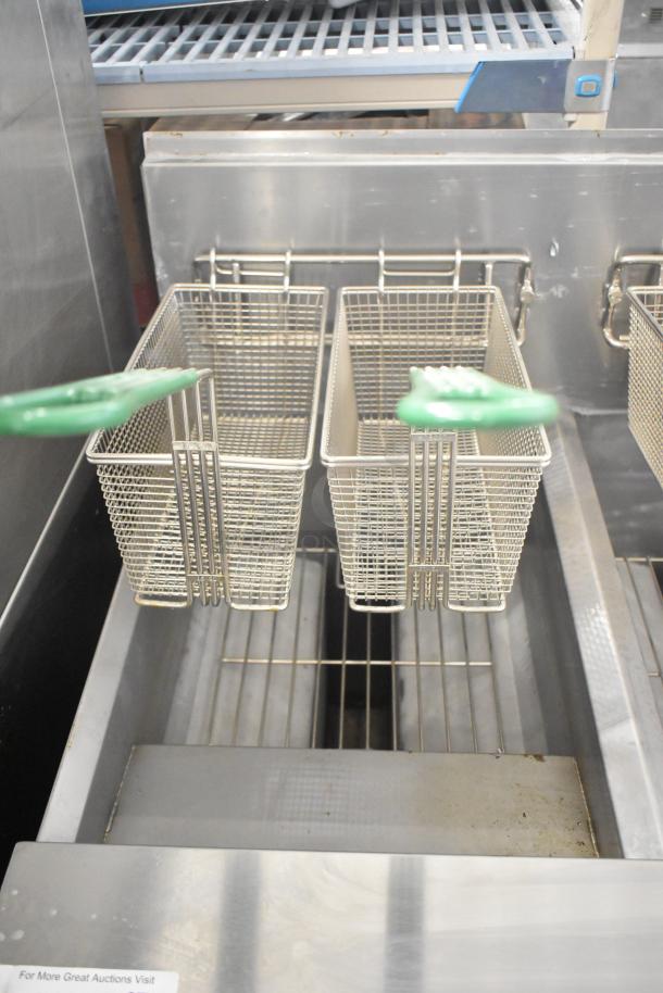 Frymaster FPPH255CSE deep fat fryer, 2021 model, propane gas, four metal baskets, filtration system, on commercial casters.