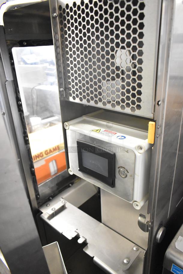 JBT 2ND-GEN-MFJ-HE commercial citrus juicer on casters, 120V, 1 phase. Features hexagonal vent and control panel.