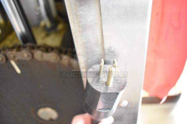 JBT 2ND-GEN-MFJ-HE citrus juicer plug detail, showing heavy-duty three-prong 120V plug, part of commercial floor model.