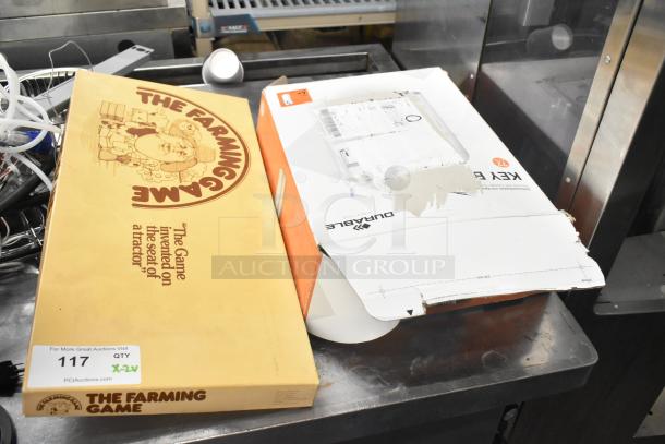The Farming Game board game in original box with quote, and Durable Key Box, both slightly worn packages.