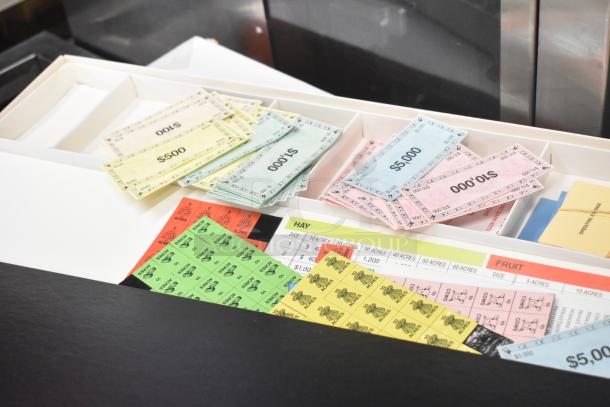 The Farming Game components: play money, cards, and board in original box, vibrant and well-preserved.