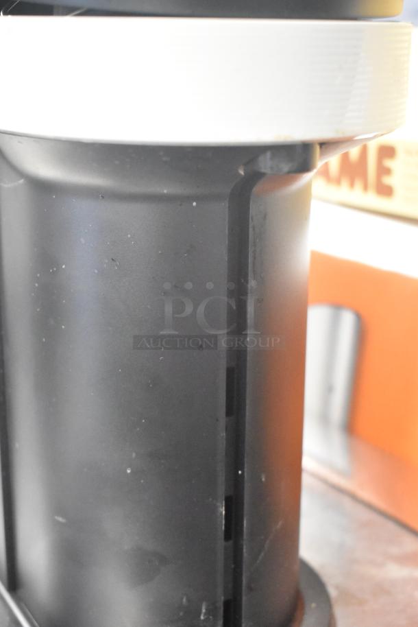 Breville BNV520GRY Nespresso machine, black base close-up, sleek design. Model BNV520GRY, 120V, 1 Phase.