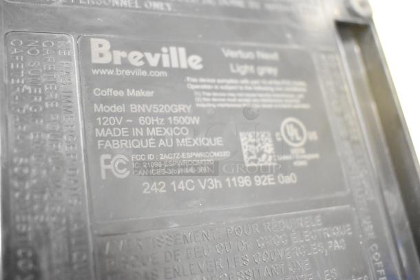 Breville BNV520GRY Nespresso Espresso Machine tag showing model, 120V, 60Hz, 1500W, made in Mexico, and various certifications.