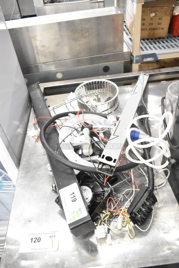 20 various items including ballasts, blower wheel, wires, tubes. For auction with 20 times bid option. Quantity tags visible.