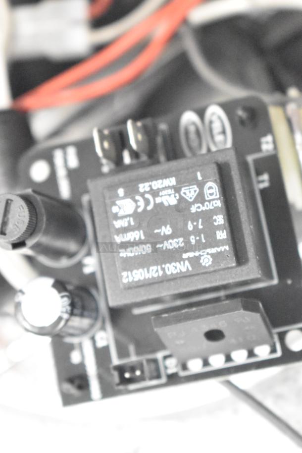 Electronics module with visible connector ports and capacitors. Includes a relay labeled "VN20-22, PTC." Appears in used condition.