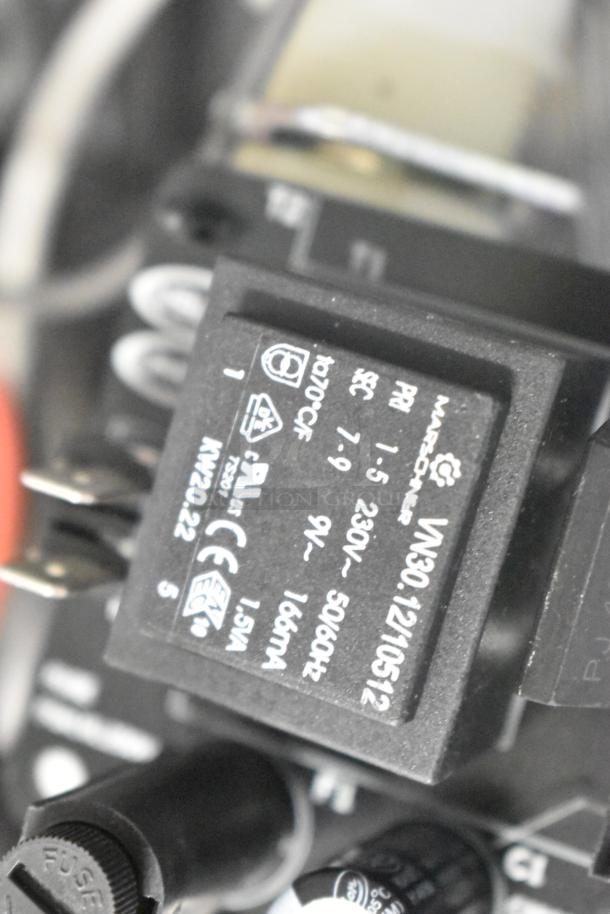 Close-up view of a black ballast labeled "VN30.121-10512" by Nagrone, indicating 230V, 50/60Hz, 1.5VA, in good condition.