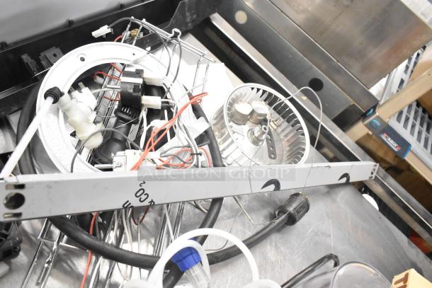 Assorted mechanical components including wires, blower wheel, ballasts in used condition. Multiples of each item shown.