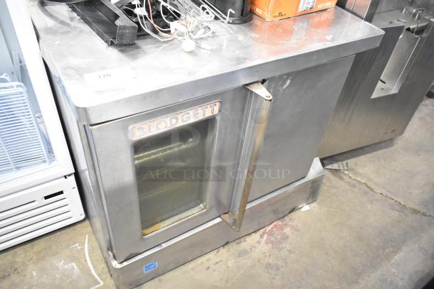 Blodgett commercial full-size convection oven with view-through door, solid door, and thermostatic controls, stainless steel.