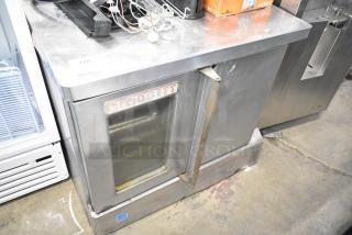 Blodgett commercial full-size convection oven with view-through door, solid door, and thermostatic controls, stainless steel.