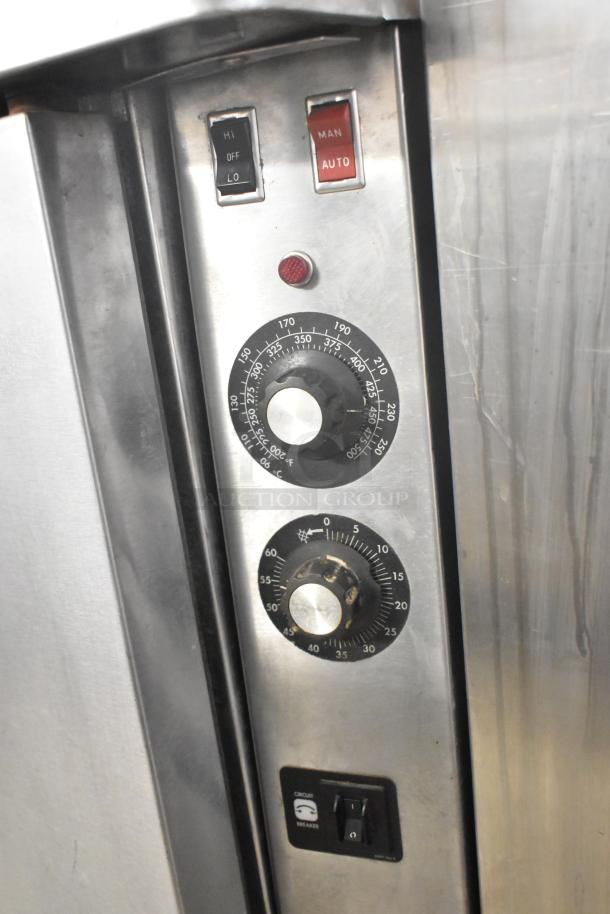 Blodgett commercial full-size convection oven controls, featuring temperature dials, manual/auto switch, and hi/lo setting.