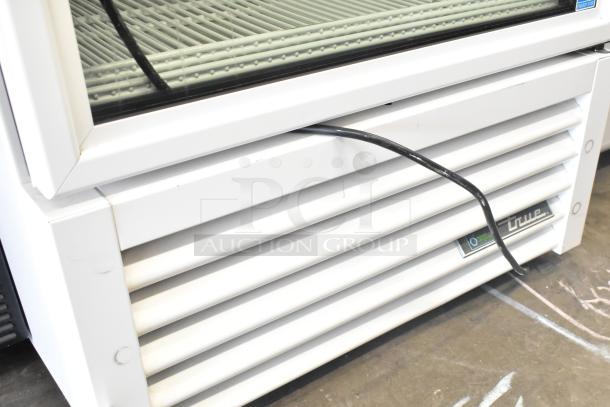 2024 True TSCI-600R-G-PH commercial cooler. Single door, 115V, 1-phase. Features include glass door and label.