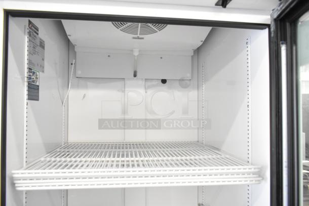 2024 True TSCI-600R-G-PH single door reach-in cooler with glass door and wire shelving. 115V, 1 phase, excellent condition.