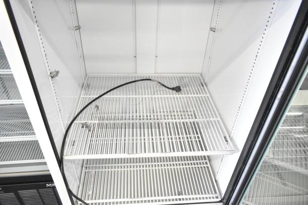 2024 True TSCI-600R-G-PH single door reach-in cooler merchandiser. Features wire shelves, interior power cord, 115V, 1 phase.
