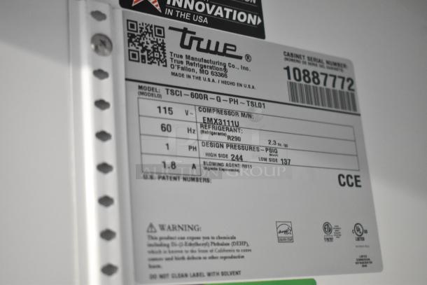 Label on a 2024 True TSCI-600R-G-PH commercial cooler, showing specs: 115V, 1 Phase, R290 refrigerant. Serial 10887772.