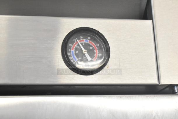 Temperature gauge on a 2017 True T-19F Commercial Freezer, model TSCI-600R-G-PH. Reads in Fahrenheit and Celsius.