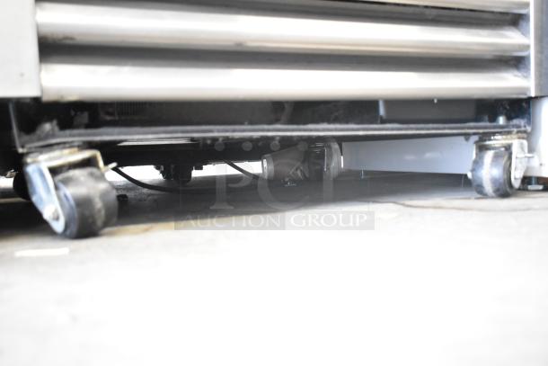 2017 True T-19F Reach In Freezer base with caster wheels, model TSCI-600R-G-PH, for easy mobility, in good condition.