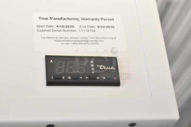 True TSCI-600R-G-PH cooler control panel with warranty label. Serial number 11118154, valid from 4/10/2025 to 5/10/2030.